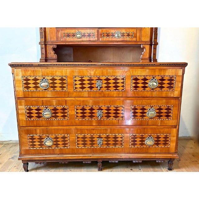 Remarkable late 18th century cherrywood buffet vitrine/ chest of drawers with fine inlay works coming from the famous...