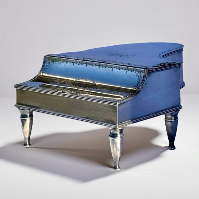 This antique piano-form trinket box was made by the Barbour Silver Company and carries the impressed Barbour backstamp on...