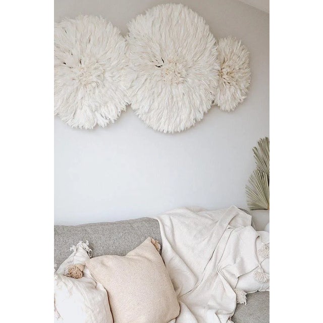 Bring timeless elegance into your home with this handmade white Juju hat—a stunning boho-chic wall decor piece crafted...