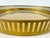 A vintage round brass-tone gallery tray featuring a continuous pierced metal railing with slender vertical openings and a...