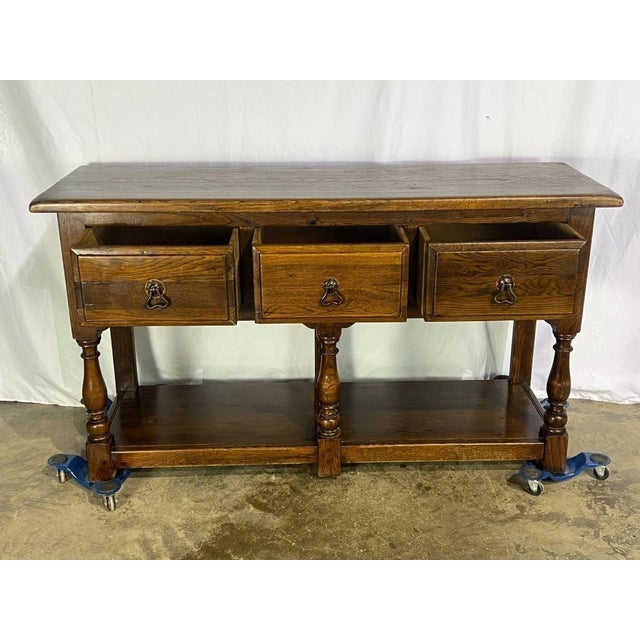 Antique Oak Welsh English Oak Server featuring three drawers with metal drop ring pulls and a spacious lower pot board....