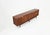 A wooden sideboard comprising five drawers, two lockable doors concealing a shelf, and two sliding doors each concealing a...