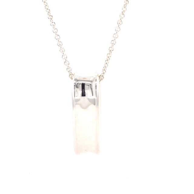 A distinctive Tiffany & Co. 1837 Collection oval loop pendant necklace crafted in sterling silver, featuring the...