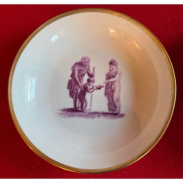 Neoclassical Antique 19th Century English Regency Porcelain Saucer Dishes With Adam Buck Domestic Scene in Puce Purple Circa 1810 - A Pair For Sale - Image 3 of 6