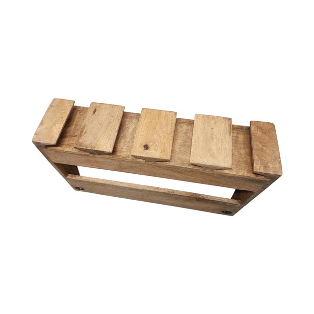 Wooden wall-mounted wine rack with slots for glasses and bottles. • Holds 4 wine glasses securely • Accommodates 4-5 wine...