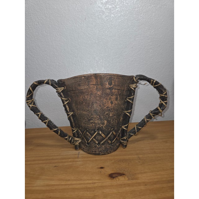 Raw, organic, and deeply expressive, this handcrafted clay vessel embodies the beauty of primitive artistry and natural...