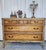 This antique French provincial style dresser features striking book matched burl wood grain and ornate gold leaf trim. The...