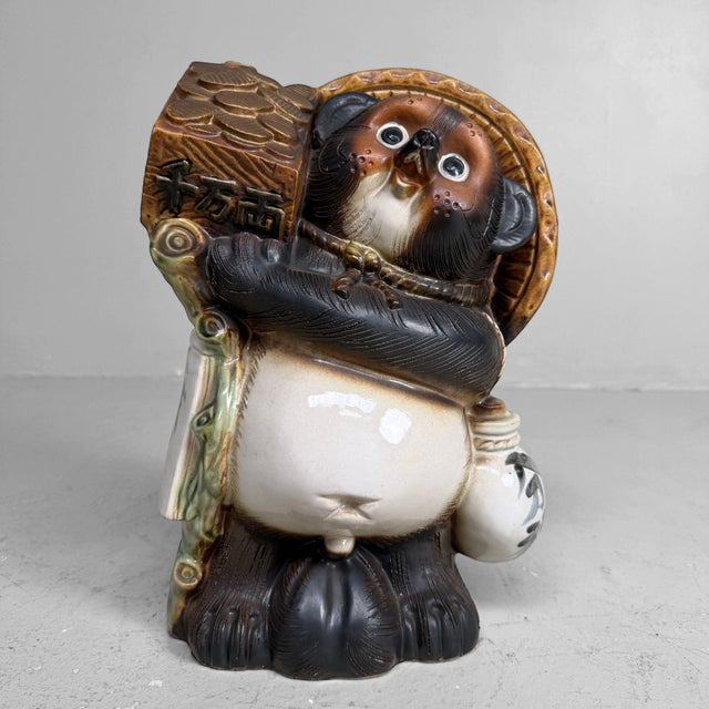 Decorative vintage Japanese tanuki, made of glazed ceramic and likely dating from the 1960s–1970s. Dimensions: height 37...