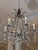 Design Plus Gallery presents the Chantilly Chandelier from Dennis & Leen. The hand-forged iron frame displays sweeping...