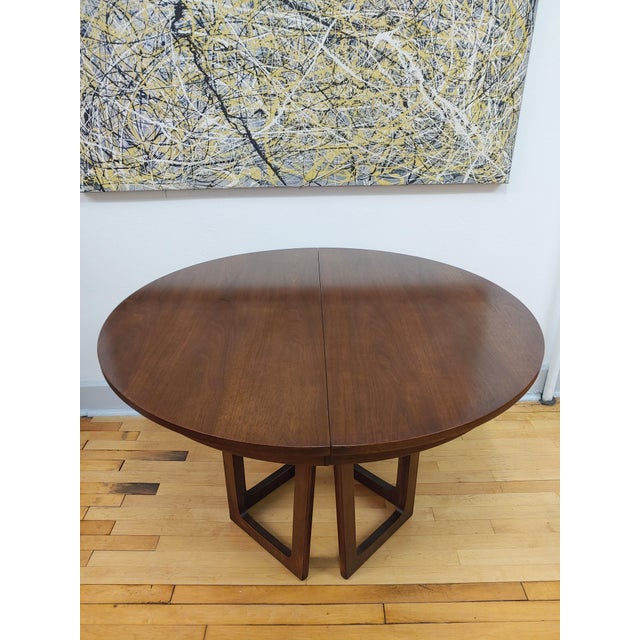 Here's a rare find! This walnut dining table was created by Broyhill Furniture Company in 1964 as indicated by the serial...