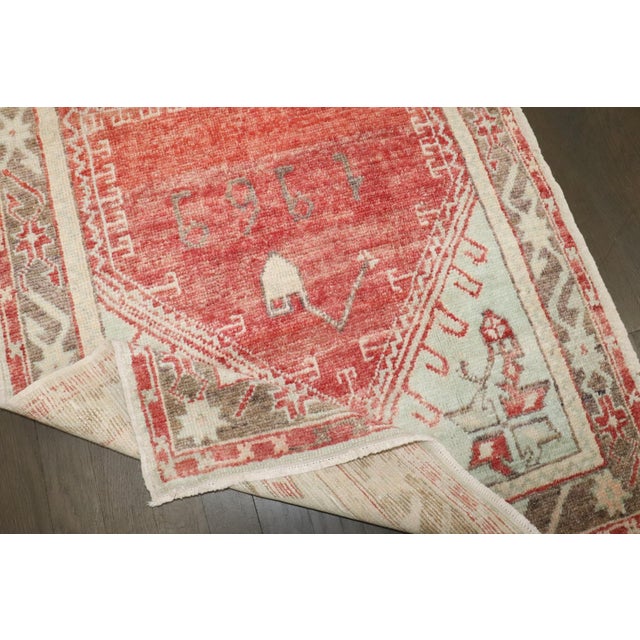 A Turkish anatolian rug with a prayer niche design dated 1969