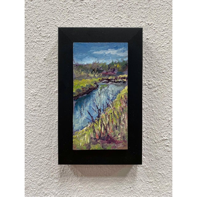 This oil on panel artwork captures a serene view along the Highline Canal, where gentle ripples reflect the sky's hues....