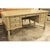 Vintage-style desk with a factory distressed taupe finish and traditional carved detailing. Features four drawers—two on...