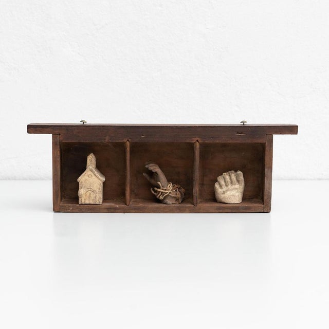 Cabinet of curiosities of plaster figures and pieces in a wooden drawer. Made in traditional Catalan atelier in Olot,...