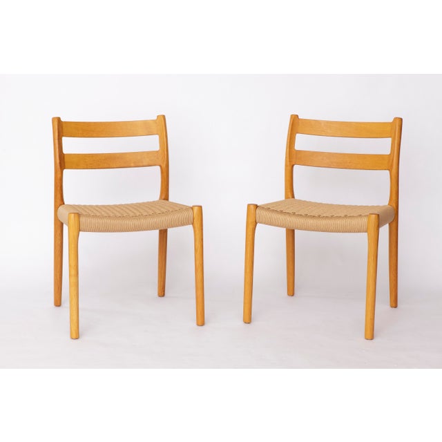 Set of 6 Dining Chairs by Niels Otto Møller Model 84, Oak Version, 1970s Crafted from solid oak, the frames have been...