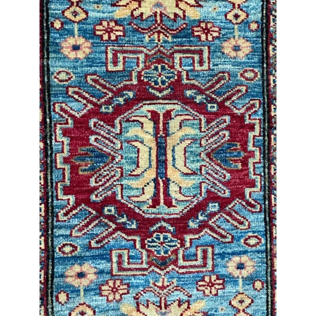 Pretty little Chobi rug with a nice design of old Caucasian rugs and beautiful colours with a sky blue field, red, yellow...