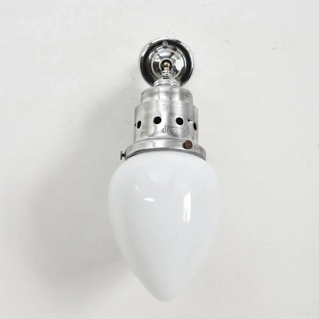 Antique gecoray opaline wall light an opaline wall light. The aluminium metalwork on the gec gallery has been polished...