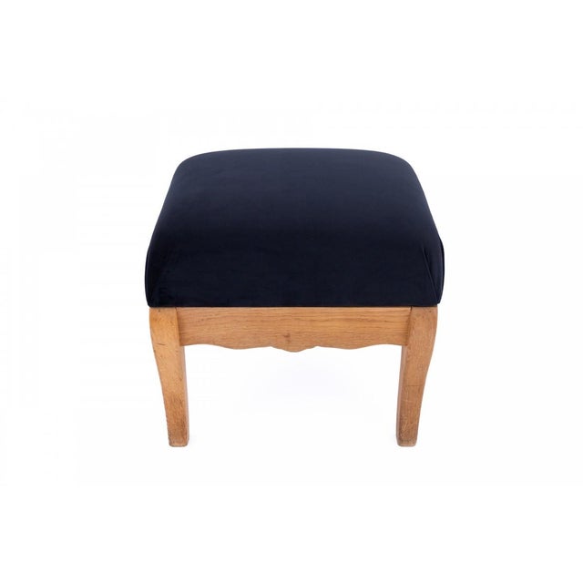 Mid-20th-century armchair with footstool, scandinavia. an elegant wingback armchair with a matching footstool, originating...