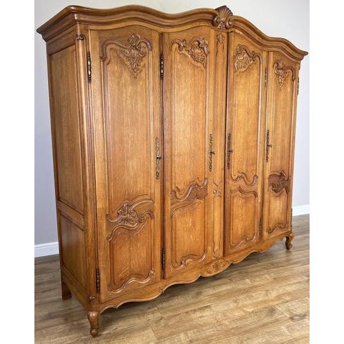 This elegant Vintage French Louis wardrobe is a striking statement piece, showcasing graceful curves and refined...