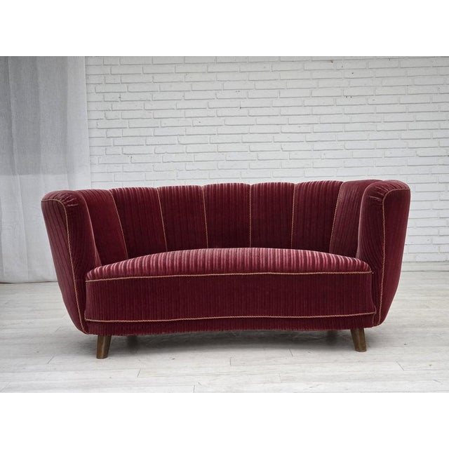 1960s, Danish 2-seater "Banana" sofa. Original striped red furniture velour, oak wood legs, brass springs in the seat....