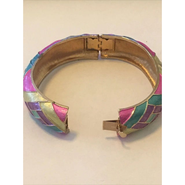This is part of Chairish’s Costume Jewelry assortment. This Palm Beach style Vintage Kramer Multi-Color Enamel Hinged...