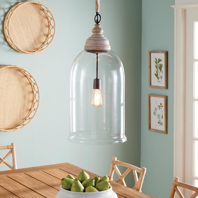 Alone or as a pair, this oversized cloche pendant is an elegant mix of glass and wood. Elongated for drama, and scaled to...