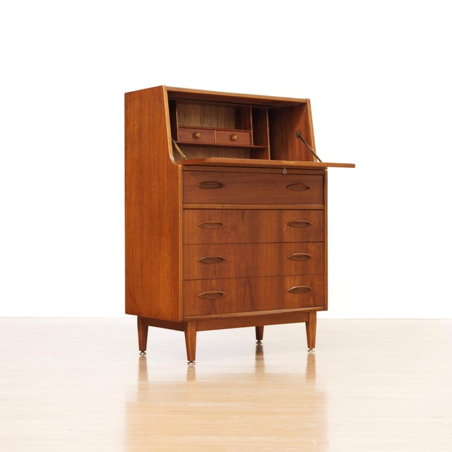 This fabulous mid century desk/cabinet was manufactured Jentique Furniture during the 1960s. The teak cabinet has a warm,...