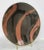 Smart design in black and brown stripes. Heavy stoneware deep charger with a bold brown brush across a jet-black field....