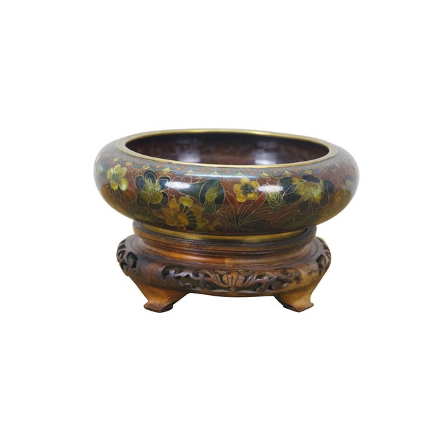 Vintage Chinese enameled brass brush bowl featuring a thousand flowers floral theme paired with a carved elm wood stand....