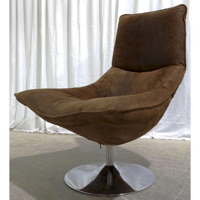 I’m selling a gently used suede leather and chromed tulip base swiveling lounge chair, Hopper Bucket style, with a deep...