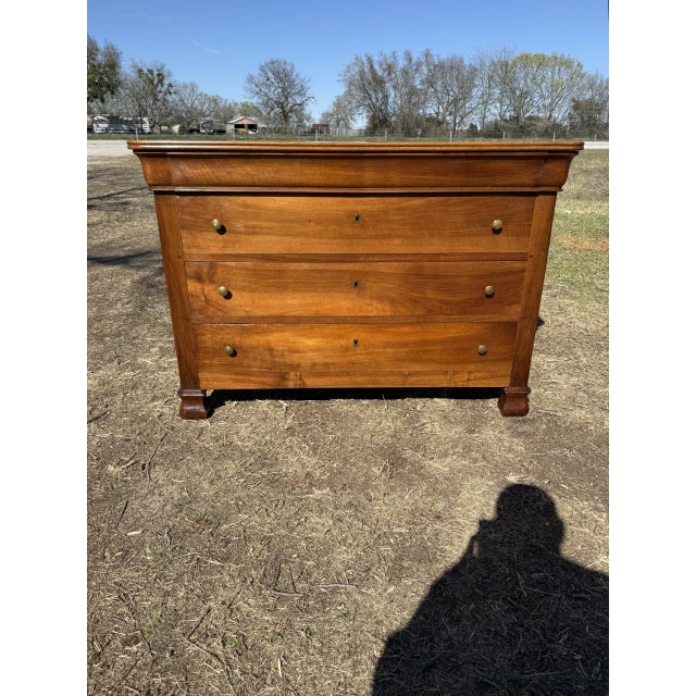 19th Century French Louis Philippe Commode from France. Made of Solid walnut, the wood has been finished with a lustrous...