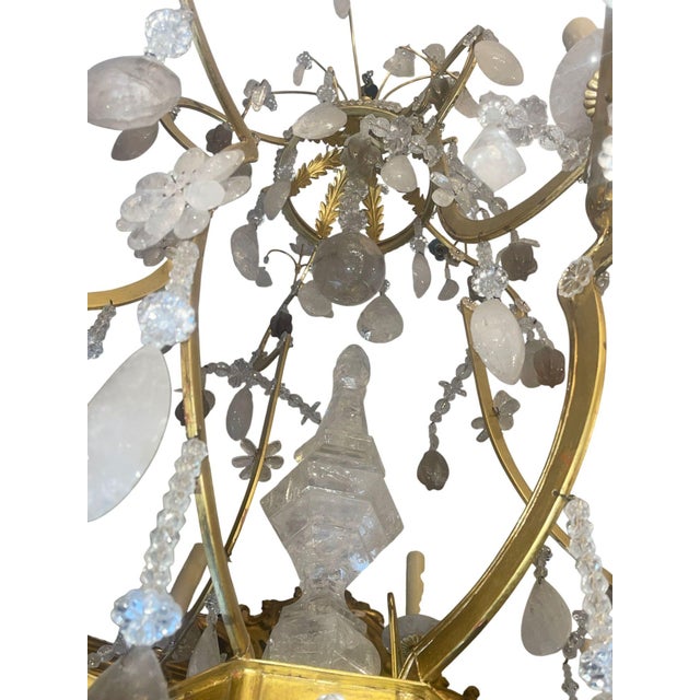 A glamorous and substantial 20th century Italian chandelier, richly finished in luminous 22K gold leaf and adorned with an...