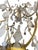 A glamorous and substantial 20th century Italian chandelier, richly finished in luminous 22K gold leaf and adorned with an...