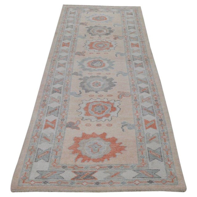 Hand-knotted with care using traditional rug-making techniques, this wool rug blends timeless craftsmanship with a modern...