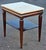 A 1960s Regency Style Tiered Mahogany Side Table With Marble Top Measure 18" in width, 24" in depth and 23.75" in height...