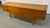 Crafted from richly grained walnut, the table features clean architectural lines and a warm, beautifully figured wood...