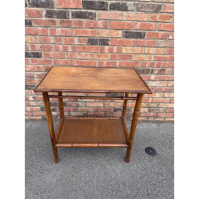 This is a beautiful 19th century English bamboo side table with lovely aged patina! Tables like these make excellent...