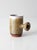 Vintage handmade studio pottery mug showcasing an organic modern form with a sculptural side handle and richly textured...