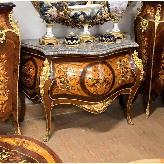 A magnificent French Louis XV-style commode showcasing exceptional decorative craftsmanship and timeless European...