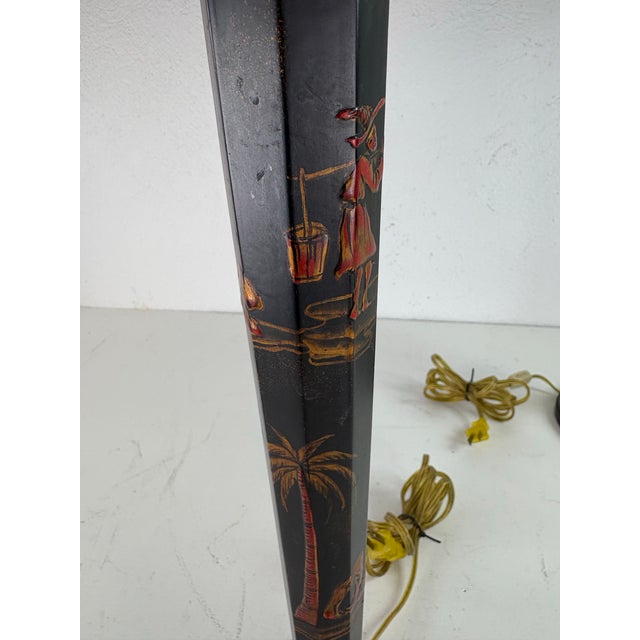This is a pair of hand painted Japaned metal table lamps by Sarreid. These lamps have been hand painted with Asian...