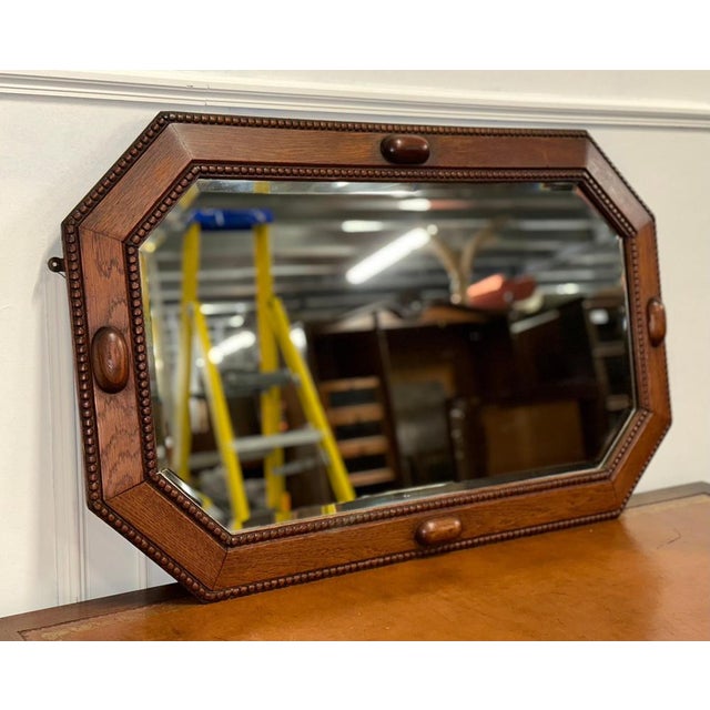Art Deco 1920s Oak Bevelled Mirror. An Art Deco 1920s Oak Beveled Mirror is a stunning piece of antique furniture that...