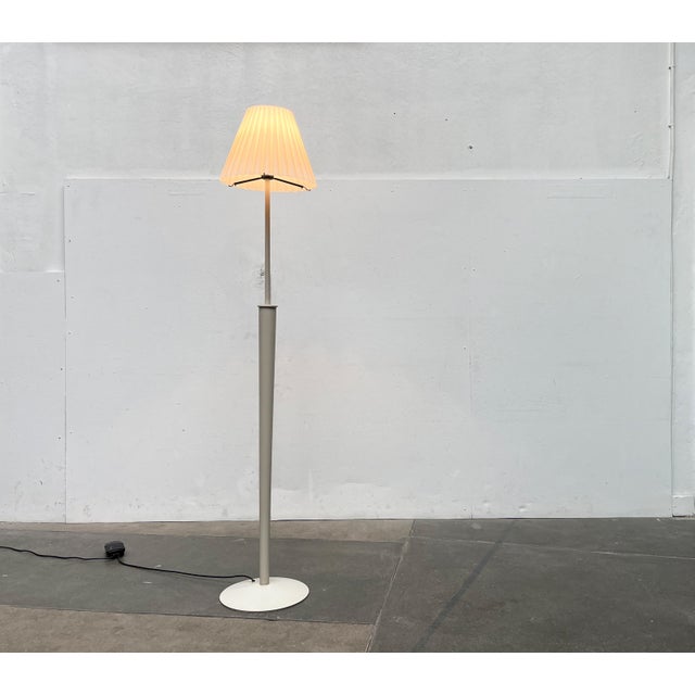 Italian floor lamp with a special base and shade. The special detail of this lamp is the elaborate glass shade. The glass...