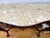 An exquisite Italianate carved walnut console table, richly detailed with dramatic Rococo-inspired ornament and a warm,...