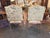 This elegant pair of antique French Louis XV style bergère armchairs features hand-carved solid walnut frames with classic...