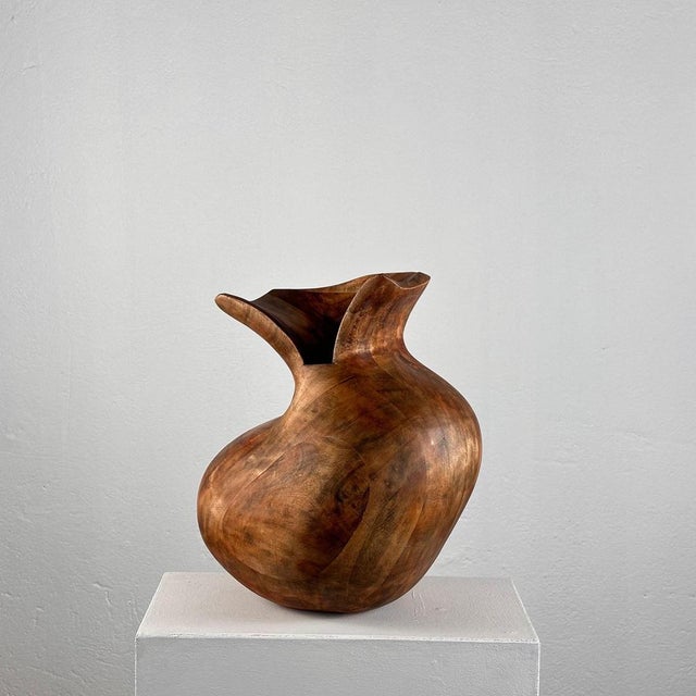 This striking phytomorphic sculptural wooden vase, crafted in Italy in the 1960s, embodies the elegance and organic beauty...