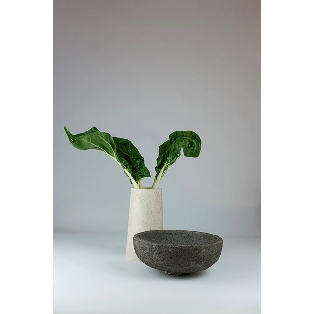 Strand after strand, the clay stratifies like a memory deposited over time. Marble holds the silent weight of ages, of...