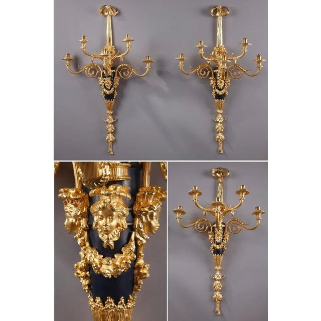 This outstanding pair of gilt and patinated bronze sconces are beautifully designed in louis xvi style. Of monumental size...