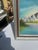 Up for consideration is a beautiful vintage framed waterside mountain landscape painting on canvas, signed by the artist....