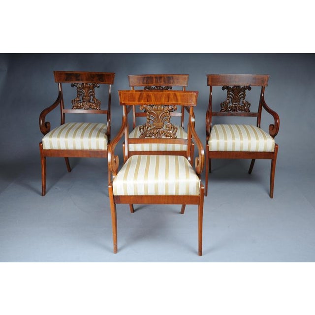 Set of 4 Biedermeier armchairs around 1835, mahogany Solid wood, finely crafted. Mahogany wood. Richly carved carving in...