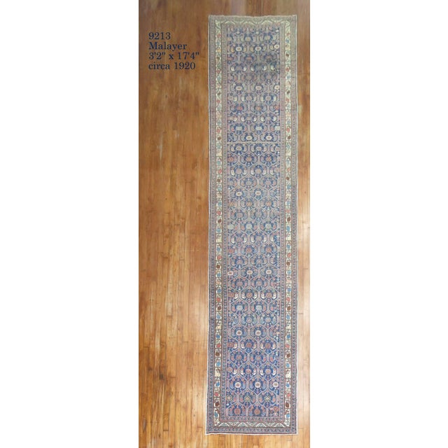 A pair of long navy blue Persian runners from the city of Malayer. Measure: 3'4'' x 17'2'' and 3'2'' x 17'4''...